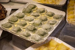 Italian food, fresh home made stuffed pasta tortelli or ravioli dumplings ready to cook, Parma, Emilia Romagna, Italy
