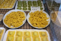 Italian food, fresh home made stuffed pasta tortelli or ravioli dumplings ready to cook, Parma, Emilia Romagna, Italy. Italian