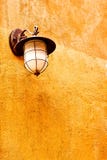 Italian Lamp On Orange Wall Stock Image