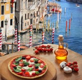 Italian pizza in Venice against canal, Italy stock photos Italian pizza in Venice against canal, Italy stock photos