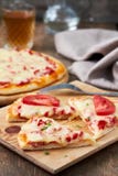 Italian Pizza With Salami, Peppers And Tomatoes Stock Images