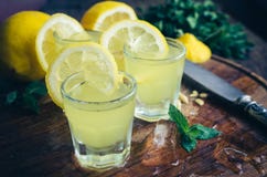 Italian traditional liqueur limoncello with lemon royalty free stock photo Italian traditional liqueur limoncello with lemon royalty free stock photo