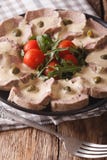 Italian Vitello tonnato with tuna sauce and capers close-up. Vertical stock image Italian Vitello tonnato with tuna sauce and capers close-up. Vertical stock image
