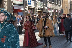 Man and woman in medieval costume at traditional parade of Epiphany Befana medieval festival in Florence, Tuscany, Italy.