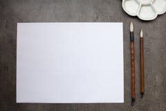 Items for drawing sumi-e, rice paper, Chinese brushes, ceramic p royalty free stock photos Items for drawing sumi-e, rice paper, Chinese brushes, ceramic p royalty free stock photos