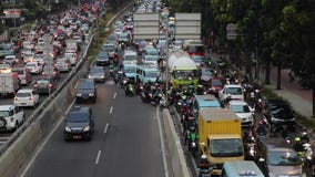 Cars and motorcycle on traffic jam in Jakarta