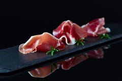 Jamon on a black background stock images Jamon on a black background stock images
