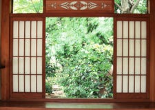 Japanese wooden entrance door background with garden outside royalty free stock photography Japanese wooden entrance door background with garden outside royalty free stock photography