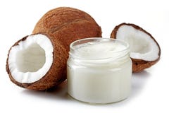 Jar of coconut oil and fresh coconuts