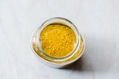 Jar Of Creamy and Smooth Juicy Peanut Butter on Marble Surface stock photo Jar Of Creamy and Smooth Juicy Peanut Butter on Marble Surface stock photo