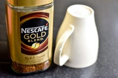 Nescafe Gold Blend instant coffee and cup Royalty Free Stock Photos Nescafe Gold Blend instant coffee and cup Royalty Free Stock Photos
