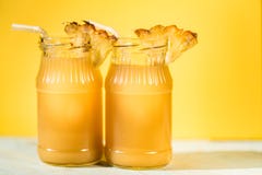 Pineapple juice and slice placed on a wooden table Royalty Free Stock Image Pineapple juice and slice placed on a wooden table Royalty Free Stock Image