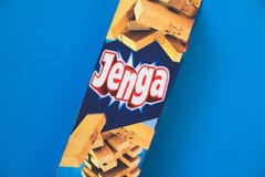 Jenga tower game - wood blocks on blue background stock photos Jenga tower game - wood blocks on blue background stock photos