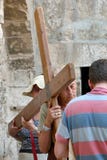 Jerusalem, Israel, 06.07.2007 a group of people carrying a wooden cross at the walls of a church in Jerusalem royalty free stock photo Jerusalem, Israel, 06.07.2007 a group of people carrying a wooden cross at the walls of a church in Jerusalem royalty free stock photo