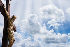 Jesus on a cross against blue sky with white clouds Royalty Free Stock Photo Jesus on a cross against blue sky with white clouds Royalty Free Stock Photo