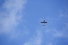 Jet airliner plane flying high in the sky stock photos Jet airliner plane flying high in the sky stock photos