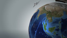 Jet planes fly around the globe of Earth