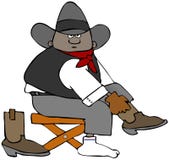 Jeune cowboy tirant sur ses bottes Image libre de droits Jeune cowboy tirant sur ses bottes Image libre de droits