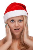 Jeune femme blond dans le chapeau de Santa photographie stock libre de droits Jeune femme blond dans le chapeau de Santa photographie stock libre de droits