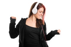 Jeune fille dans un pull molletonné à capuchon dansant sa chanson préférée photo stock Jeune fille dans un pull molletonné à capuchon dansant sa chanson préférée photo stock