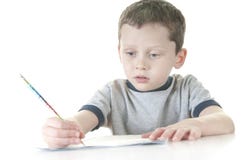 Jeune garçon travaillant à l'école images stock Jeune garçon travaillant à l'école images stock