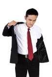 Jeune homme d'affaires mettant sur le costume, d'isolement sur le blanc photo stock Jeune homme d'affaires mettant sur le costume, d'isolement sur le blanc photo stock