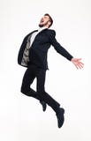 Jeune homme heureux exalté enthousiaste d'affaires sautant et criant Photographie stock Jeune homme heureux exalté enthousiaste d'affaires sautant et criant Photographie stock