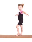 Jeunes équilibres de gymnaste sur le faisceau image libre de droits Jeunes équilibres de gymnaste sur le faisceau image libre de droits