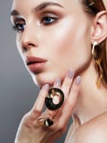 Jewelry on beautiful girl. woman with make-up and jewels stock image Jewelry on beautiful girl. woman with make-up and jewels stock image