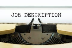 Job description word typed on a yellow vintage typewriter. Business concept stock photos Job description word typed on a yellow vintage typewriter. Business concept stock photos