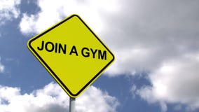 Joignez un signe de gymnase contre le ciel bleu illustration stock Joignez un signe de gymnase contre le ciel bleu illustration stock