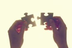 Joining two pieces of jigsaw puzzle. Solution, business. Stock Photography Joining two pieces of jigsaw puzzle. Solution, business. Stock Photography
