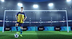 Jonge voetballer met bal voor het doel op een professi stock fotografie Jonge voetballer met bal voor het doel op een professi stock fotografie