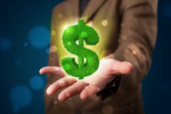 Jonge zakenman die groen gloeiend dollarteken voorstellen Royalty-vrije Stock Afbeeldingen