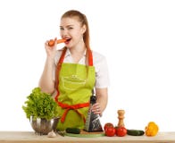 Jovem mulher 'sexy' bonita que cozinha a refeição fresca imagens de stock royalty free Jovem mulher 'sexy' bonita que cozinha a refeição fresca imagens de stock royalty free