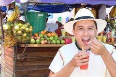 Joyful ethnic male at fruit market stock image Joyful ethnic male at fruit market stock image