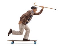 Joyful senior holding a cane and riding a longboard stock images Joyful senior holding a cane and riding a longboard stock images