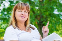 Joyful woman of 50 years on the bench stock photos Joyful woman of 50 years on the bench stock photos