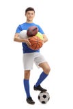 Jugendathlet mit verschiedenen Arten von Sportbällen Stockfotografie Jugendathlet mit verschiedenen Arten von Sportbällen Stockfotografie