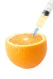 Juicy Orange With Syringe Stock Photos