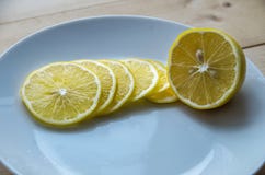 Juicy yellow lemon on a plate royalty free stock image Juicy yellow lemon on a plate royalty free stock image