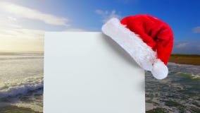 Jultomtenhatt med det vita kortet och havet Jultomtenhatt med det vita kortet och havet