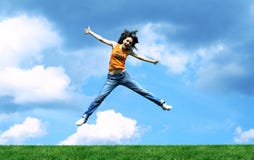 Jump Girl Over A Grass Stock Photography