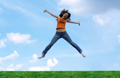 Jump Girl Over A Grass Stock Images