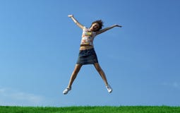 Jump Girl Over A Grass Royalty Free Stock Photo