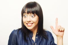 junge Frau mit ihrem Finger oben Gute Idee! Stockfoto junge Frau mit ihrem Finger oben Gute Idee! Stockfoto