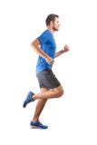 Junger attraktiver Athlet, der perfektes laufendes technisches laufen lässt und zeigt lizenzfreie stockbilder Junger attraktiver Athlet, der perfektes laufendes technisches laufen lässt und zeigt lizenzfreie stockbilder