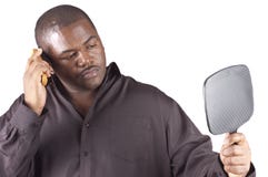 Junges afrikanisches Mannpflegen Lizenzfreies Stockbild Junges afrikanisches Mannpflegen Lizenzfreies Stockbild