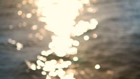 4K abstraem o bokeh obscuro da praia do mar do fundo com luz e brilho video estoque 4K abstraem o bokeh obscuro da praia do mar do fundo com luz e brilho video estoque