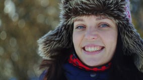 4K Close up woman portrait. Beautiful blue-eyed young woman smiles to the camera. stock footage 4K Close up woman portrait. Beautiful blue-eyed young woman smiles to the camera. stock footage